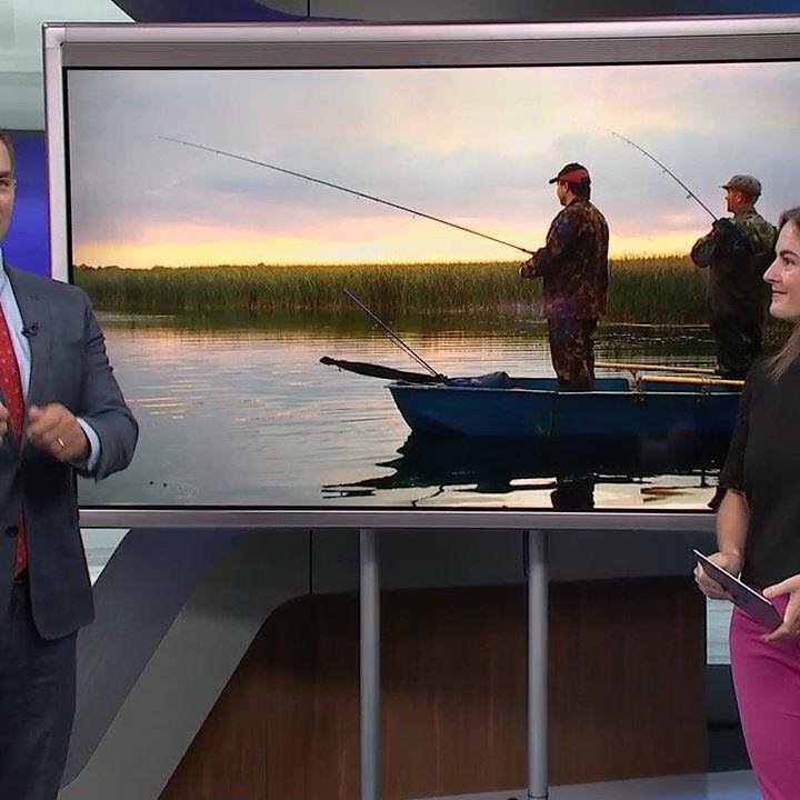 Keith Kaiser gets a lesson in fishing for catfish at Kopp's Lake